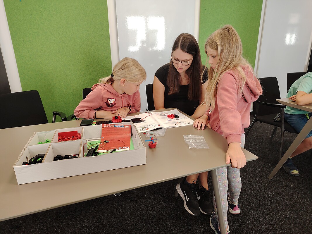 Children building renewable energy models