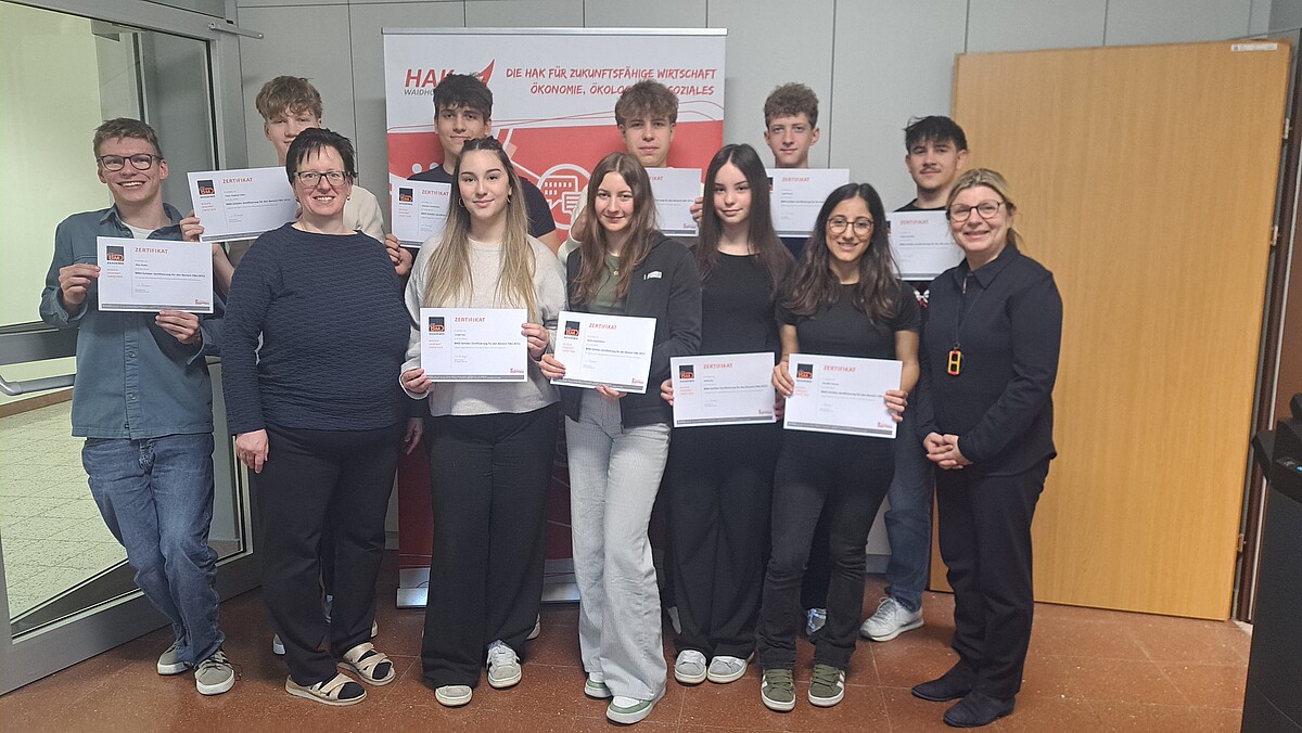 Group photo of students and teachers with BMD certificate recipients
